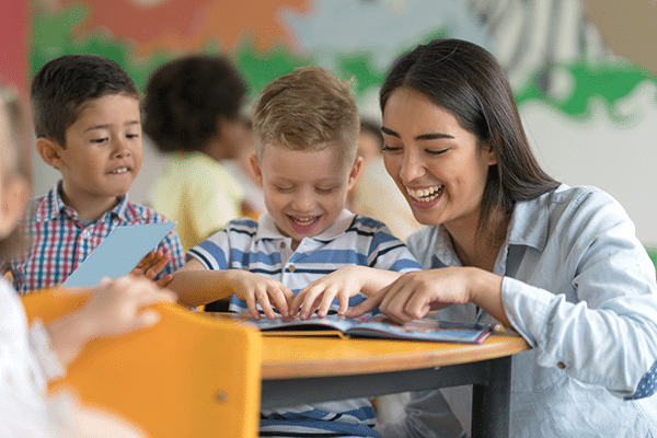 Teacher helping student