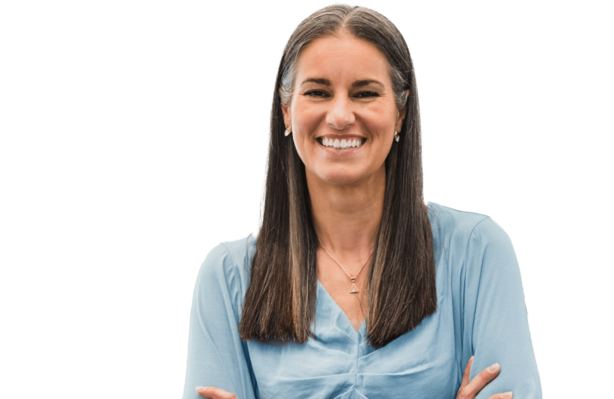 Middle aged woman with her hands folded across her chest, smiling