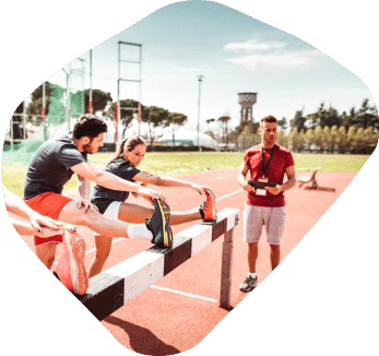 Coach with trainees at a running track