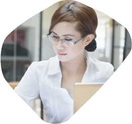 Woman wearing glasses working