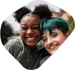 Two young girls smiling