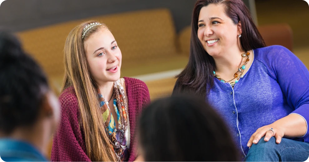 Two women discussing and laughing