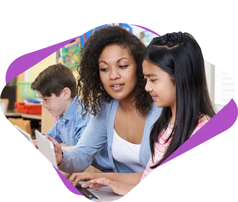 A teacher teaching a student in a classroom