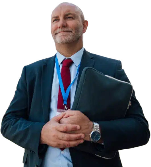 Man wearing tie and ID holding a laptop sleeve