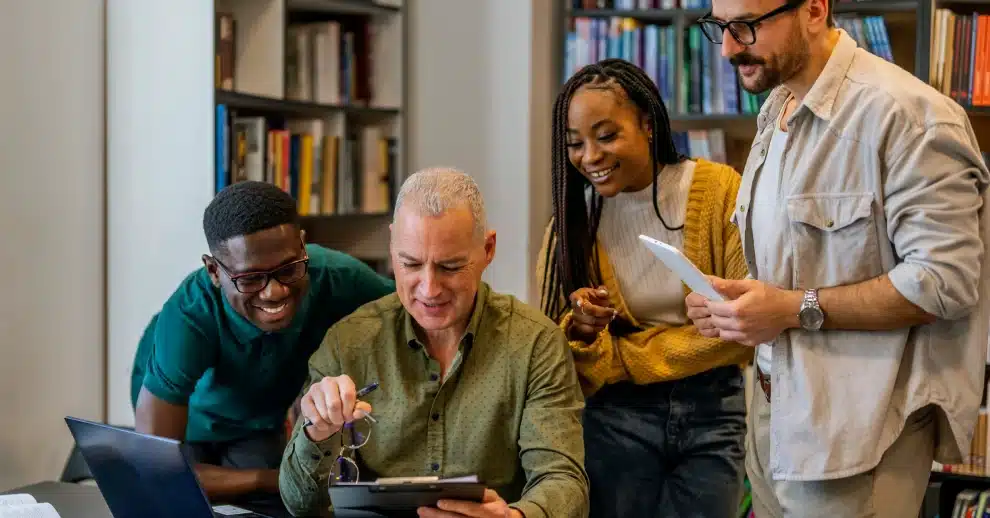 Professor with his students in a college library