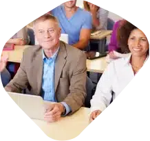 A group of adults in a classroom session