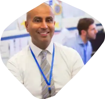 Working professional wearing a tie and ID